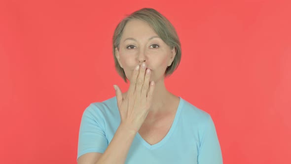 Flying Kiss By Old Woman on Red Background