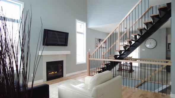 modern living room with tall ceiling and fireplace smooth pov entry real estate