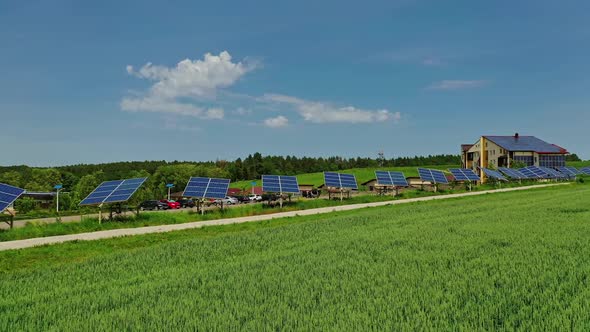 Sunny batteries on green field. Solar panels along the road in the countryside. 