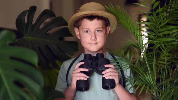 Jungle boy holding binocular