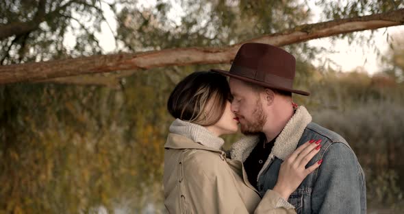 Close Up Loving Couple Under a Tree in the Park