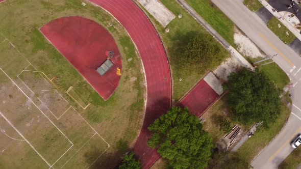 Aerial Overhead Shot Running Track Drone Turning With Curve