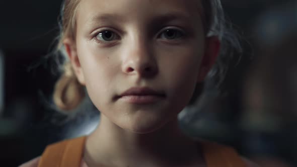 Closeup Face Frightened Girl in Dark Hall