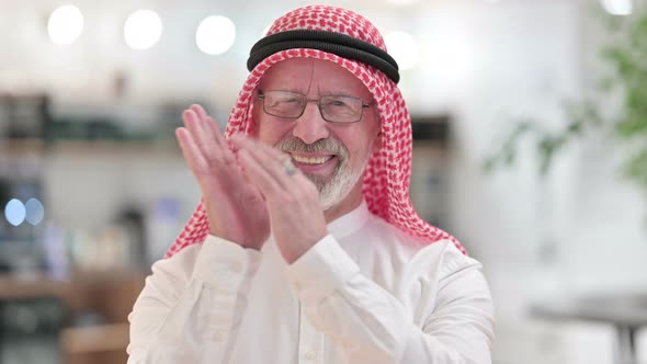 Appreciative Senior Old Arab Businessman Clapping 