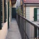 A resident of the house walks along a narrow Italian balcony-terrace.  - VideoHive Item for Sale
