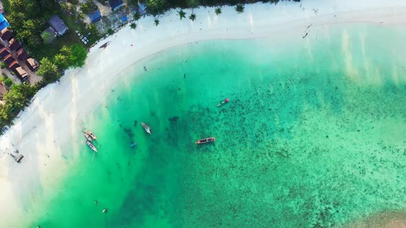 Aerial view travel of idyllic island beach lifestyle by clear ocean and white sandy background of a 