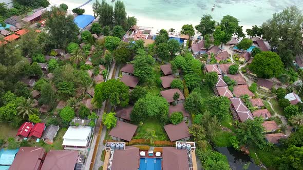 Top View of Tropical Hotel Resort on Beach with Green Palms and Crystal Water