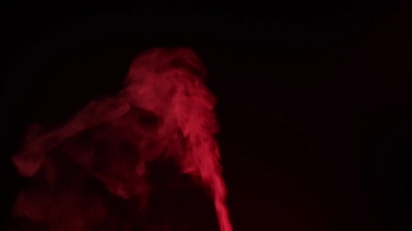 Red smoke, fog, mist, vapor on a black background. alt