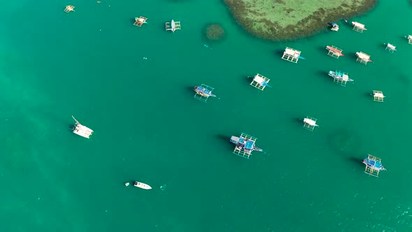 Tourist Boats in a Bay with Blue Water