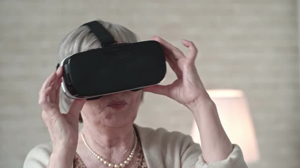 Old Woman in VR Headset Dancing with Excitement