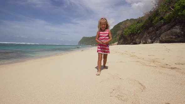 Child Runs Along the Beach.