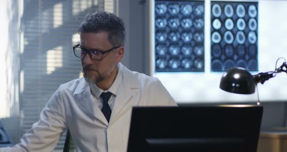 Doctor Analyzing X Ray