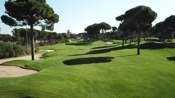 Low altitude flying over luxury and vivid golf course field in Turkey