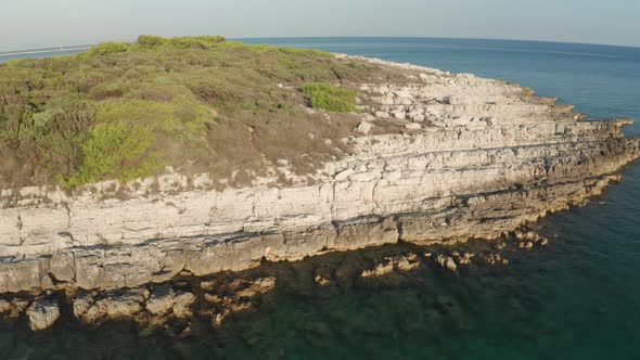 Aerial Scene Of Cape Kamenjak, Adriatic Sea, Istria, Croatia. Camera turns to the left revealing a s