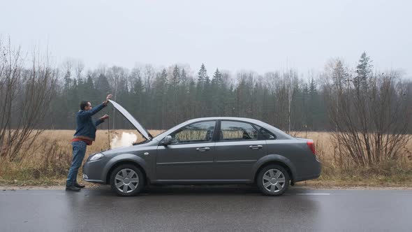 Young Man Broken Car Opens Hood