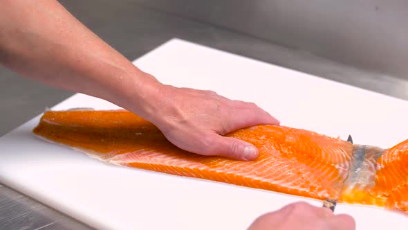 Chef Slicing Smoked Salmon Fish Fillet