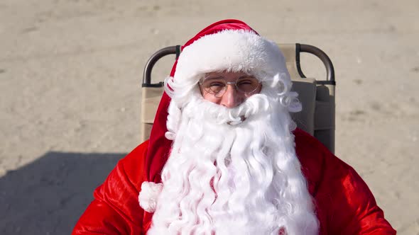 Funny Santa Claus on the Seashore