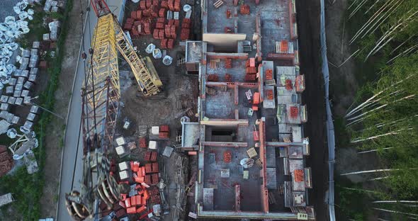 Construction site of low-rise brick houses in summer. Aerial view