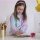 Girl Writing in Notepad Near Flowers - VideoHive Item for Sale