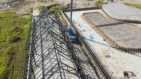 Aerial Flight View of the Metal Structure of the Roof of the House