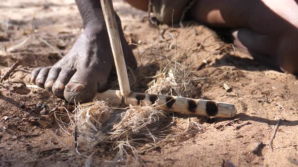 Ju hoansi bushmen tribe making fire