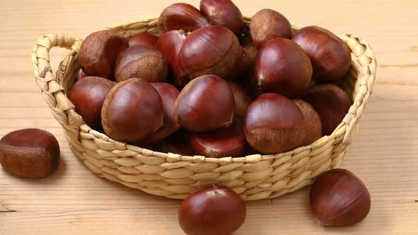   Group of sweet chestnuts in a basket close up