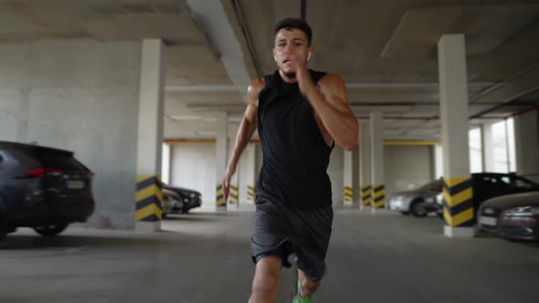 Athlete Runs Really Fast Inside the Parking Garage