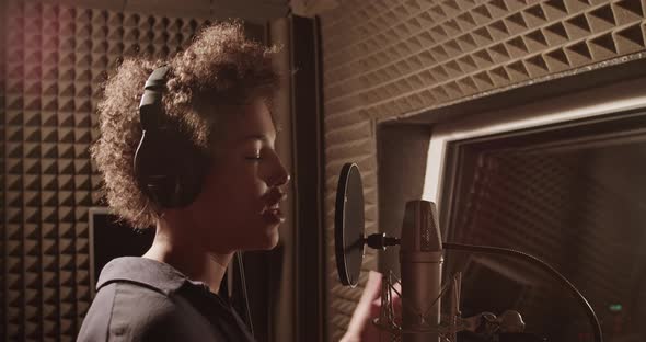 Black Woman Rapping in Recording Studio