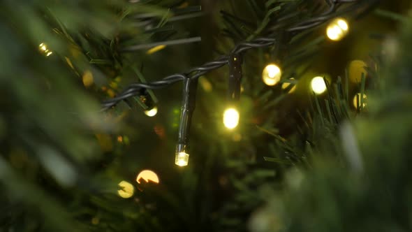 Sparkling decoration on the artificial tree  slow motion 1920X1080 HD footage - Sequence of yellow C