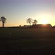 Aerial Cinematic Clip Drone Flying Over a Farm Field During Sunset - VideoHive Item for Sale