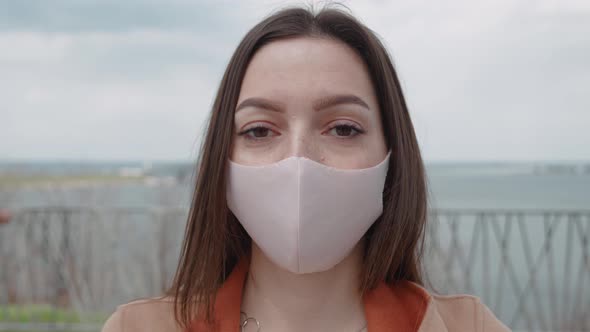 Woman with Mask Standing in Outdoor