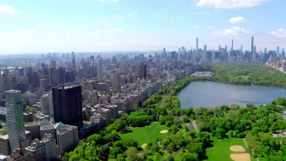 Aerial  Video Above Green Central Park in the Middle of Manhattan New York