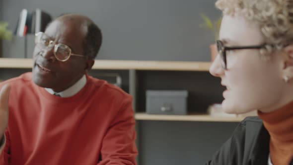 Multiethnic Colleagues Speaking at Business Meeting