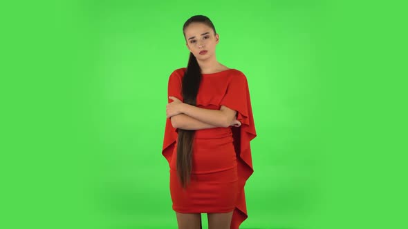 Pretty Young Woman Is Listening Attentively and Nodding His Head. Green Screen