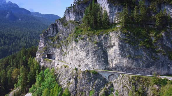 Aerial Drone Flight of an Asphalt Road in the Dolomites Mountains in Italy