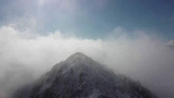 Snowy mountain ridge with clouds, Monte Barro, Lecco, Italy
