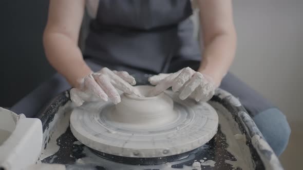 Closeup of the Hand of a Master Working on a Potter's Wheel for the Manufacture of Clay and Ceramic