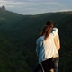 A Young Couple of Lovers on Top of a Mountain - VideoHive Item for Sale
