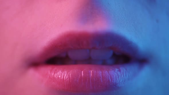 Female Lips in Colored Lighting Closeup