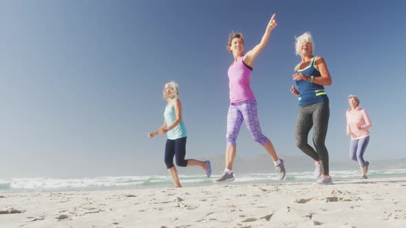 Senior women running on the beach