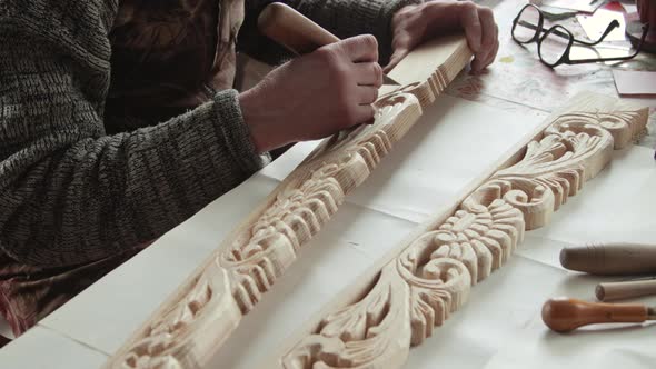 Closeup shoot of a woodcarver at work