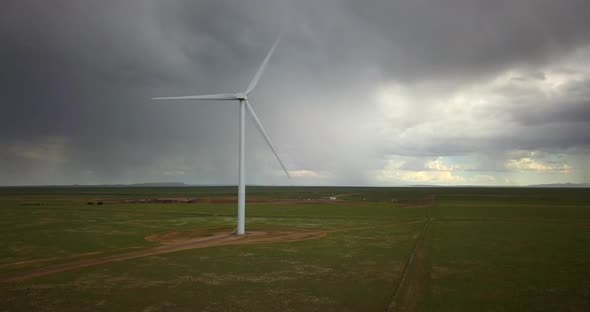 Aerial of a single windmill in the wind farm