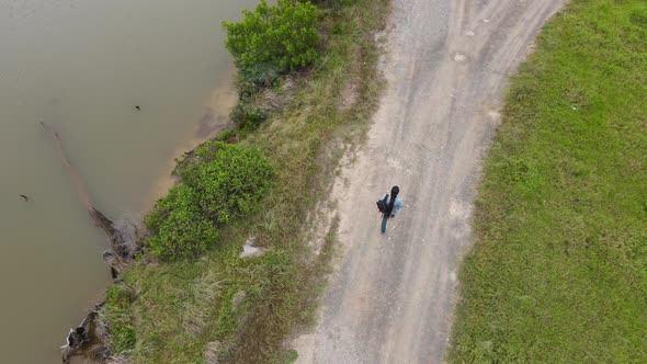 High Angle View of Person Walking Along Pathway That Splits in Two