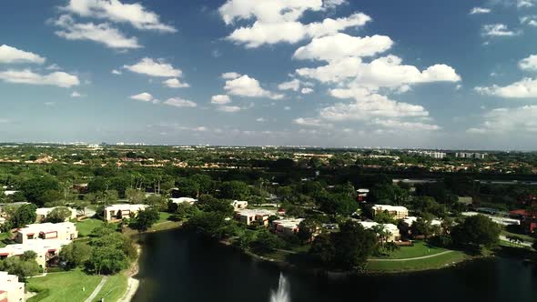 60fps (could be slow motion) aerial view of a neighborhood in Boca Raton Florida, USA