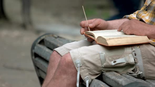 Mature Man Reading Book