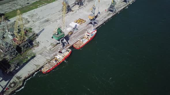 Chornomorsk. Boats Staying In Line In Dock With Cranes.