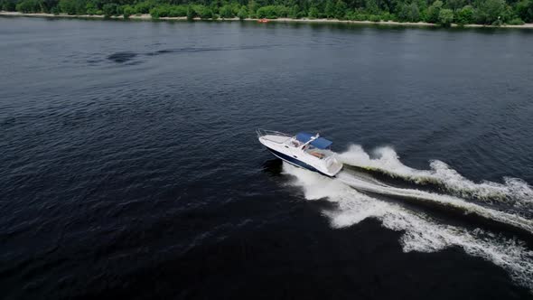 Aerial View of a Driving a Motorboat on Blue River