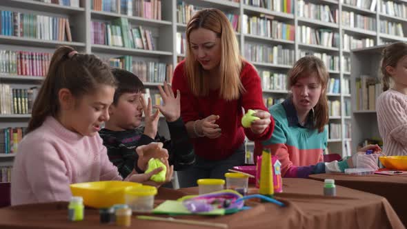 Children with Disabilities Playing Slimes in Class