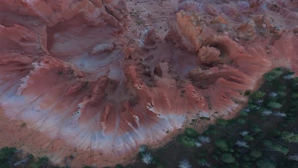 eroded terrain on edge of coniferous forest. Colored sandstone rock formation in Utah, USA. overhead