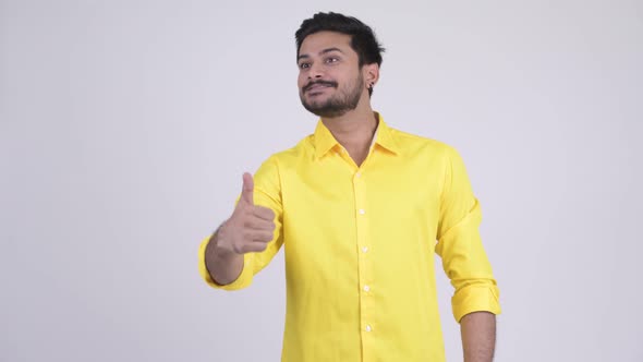 Young Happy Bearded Indian Businessman Giving Thumbs Up